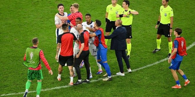 England midfielder Declan Rice clashes with Slovakia coach Francesco Calzona after the teams
