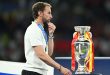 Gareth Southgate walks past the European Championship trophy after England