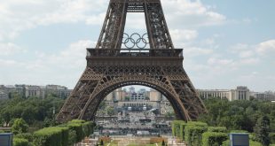 A photo of the Eiffel Tower in Paris with the Olympic logo