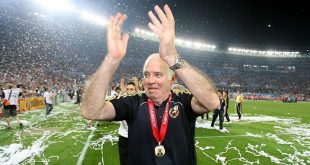 Luis Aragones celebrates on the pitch after Spain win the Euro 2008 final