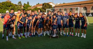 LOS ANGELES, CALIFORNIA - JULY 26: (EXCLUSIVE COVERAGE) The Manchester United pose with a fan in a wheelchair after a first team training session at UCLA on July 26, 2024 in Los Angeles, California. (Photo by Ash Donelon/Manchester United via Getty Images)