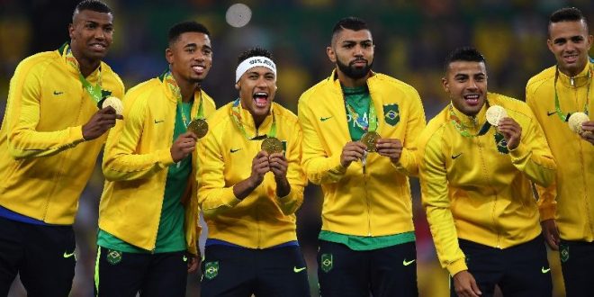 Neymar and his Brazil team-mates celebrate with their gold medals after winning the men