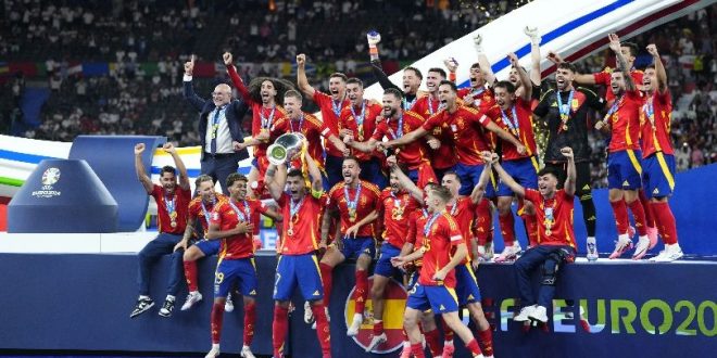 Spain players celebrate with the European Championship trophy after beating England in the final of Euro 2024.
