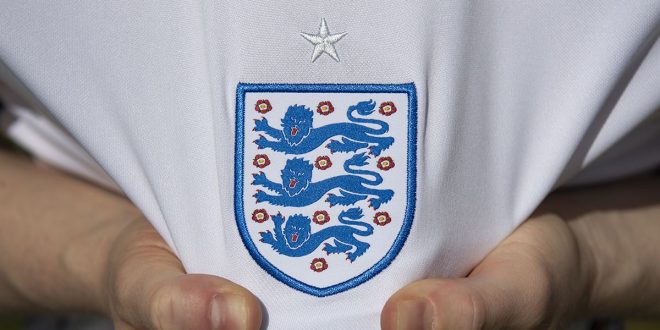 England badge on the home shirt ahead of the UEFA 2020 European Football Championship on May 27, 2021 in Manchester, United Kingdom.
