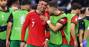 Cristiano Ronaldo of Portugal visibly upset after missing a penalty is spoken to by Diogo Dalot of Portugal during the UEFA EURO 2024 round of 16 match between Portugal and Slovenia at Frankfurt Arena on July 01, 2024 in Frankfurt am Main, Germany. (Photo by Robbie Jay Barratt - AMA/Getty Images)