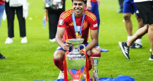 Lamine Yamal celebrates with the European Championship trophy after Spain