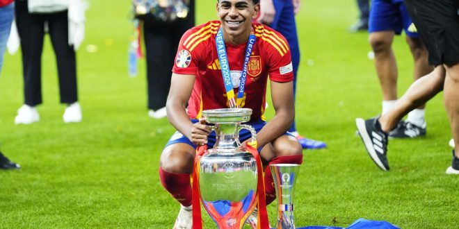 Lamine Yamal celebrates with the European Championship trophy after Spain