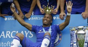 Didier Drogba celebrates one of his four Premier League titles with Chelsea