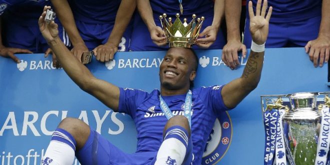 Didier Drogba celebrates one of his four Premier League titles with Chelsea