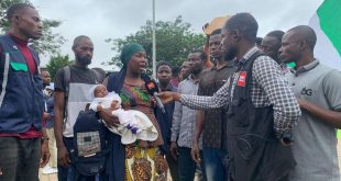 Why I chose to protest ? Nursing mother protests with her infant after her husband was killed by bandits