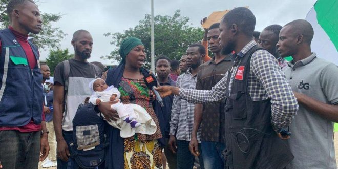 Why I chose to protest ? Nursing mother protests with her infant after her husband was killed by bandits