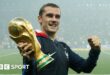 France forward Antoine Griezmann holding the World Cup trophy