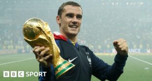 France forward Antoine Griezmann holding the World Cup trophy