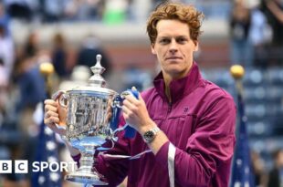 Jannik Sinner with the US Open trophy