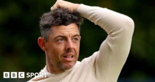 Rory McIlroy in a cream jumper