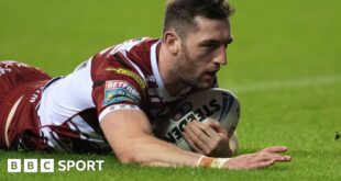 Jake Wardle dives to score a try for Wigan Warriors