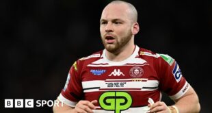 Liam Marshall running while playing for Wigan