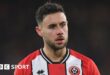 George Baldock playing for Sheffield United in the Premier League