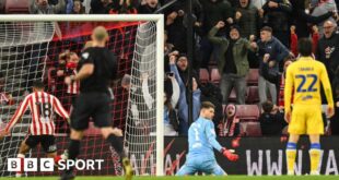 Illan Meslier looks at the ground after Sunderland's 97th-minute equaliser