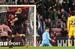 Illan Meslier looks at the ground after Sunderland's 97th-minute equaliser