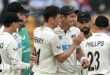 Matt Henry and Tim Southee of New Zealand celebrate a wicket against India