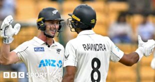 New Zealand batters Will Young and Rachin Ravindra celebrate victory in India