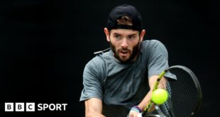 Jacob Fearnley hits a backhand return