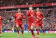 Liverpool beat Chelsea 2-1 to move top of the premier league table