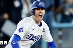 Los Angeles Dodgers first baseman Freddie Freeman celebrates after hitting a walk-off grand slam to win game one of the World Series