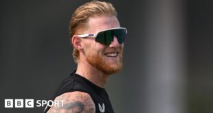 England captain Ben Stokes smiles while wearing sunglasses