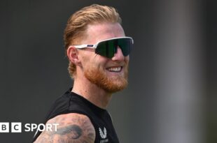 England captain Ben Stokes smiles while wearing sunglasses