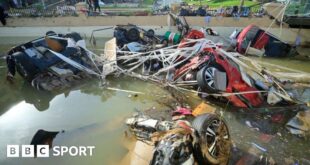 Wreckage of cars remain submerged in the water after flash floods in Valencia.