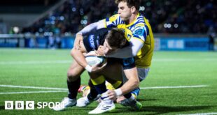 Huw Jones dives over for a try