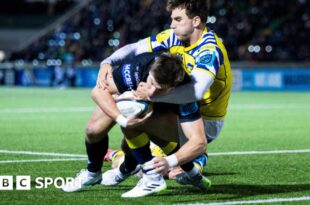 Huw Jones dives over for a try