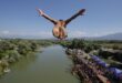 Video. Daredevils jump from historic Kosovo bridge in annual diving contest