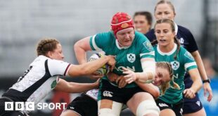 Ireland's Aoife Wafer is tackled by Canada's Caroline Crossley and Justine Pelletier