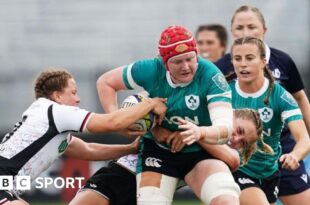 Ireland's Aoife Wafer is tackled by Canada's Caroline Crossley and Justine Pelletier