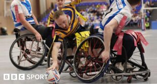 Nathan Collins reaches out with the ball for Leeds