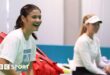 Emma Raducanu laughs during a training session for Great Britain at the Billie Jean King Cup in Malaga