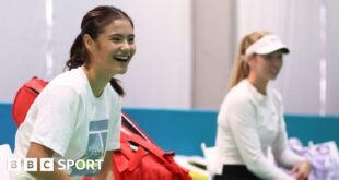 Emma Raducanu laughs during a training session for Great Britain at the Billie Jean King Cup in Malaga