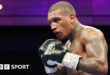 Conor Benn in black gloves during a fight