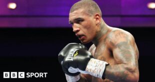 Conor Benn in black gloves during a fight