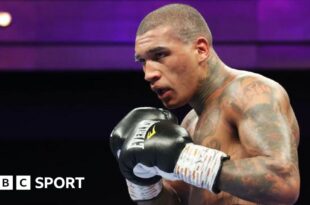 Conor Benn in black gloves during a fight