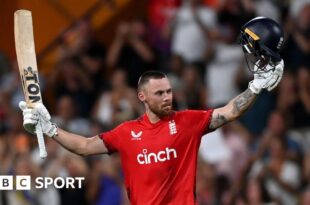 England opener Phil Salt raises his bat and helmet after hitting a century