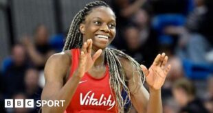 England player Funmi Fadoju smiling in a game.