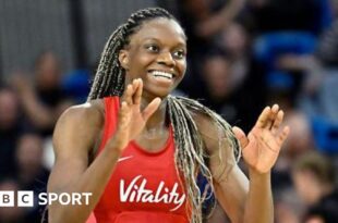 England player Funmi Fadoju smiling in a game.