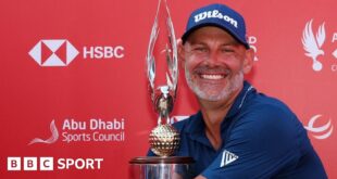 Paul Waring hugs the Abu Dhabi Championship trophy