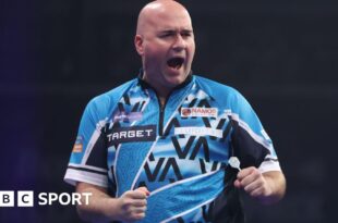 Rob Cross celebrates his win over Peter Wright