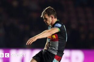 Harlequins fly-half Jamie Benson kicks the ball off a tee with his head down