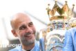 Pep Guardiola with the Premier League trophy